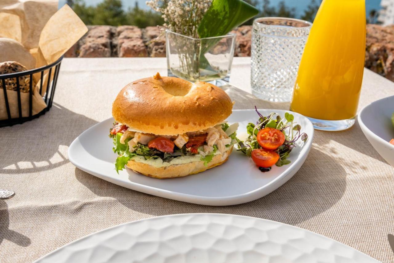 Soho Boutique Castillo De Santa Catalina - Adults Recommended Malaga Bagian luar foto A chicken caesar salad bagel